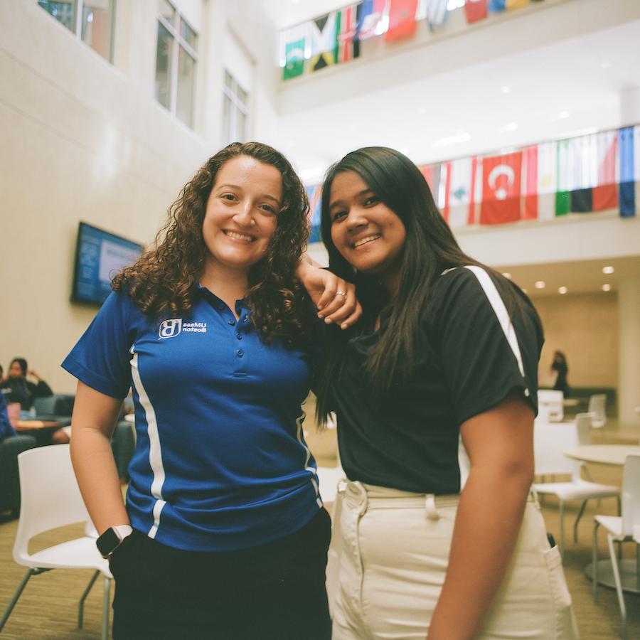 Two students smiling